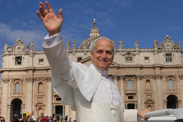 Pope Leo XIV on his popemobile tours St. Peter's Square at the Vatican prior to the inaugural Mass of his pontificate, Sunday, May 18, 2025. (AP Photo/Andrew Medichini)