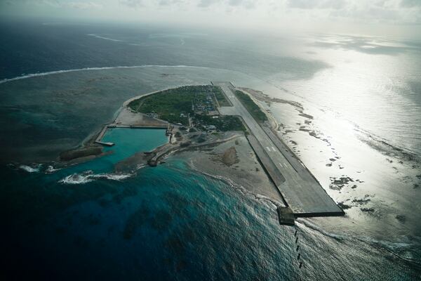 FILE - Philippine-occupied Thitu island, locally called Pag-asa island on Dec. 1, 2023, at the disputed South China Sea, is seen through an aircraft window. (AP Photo/Aaron Favila, File)