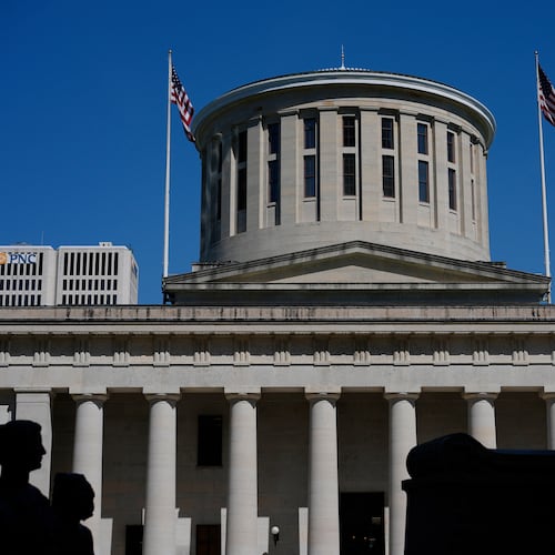 FILE - The William McKinley Monument is silhouetted in front of the west side of the Ohio Statehouse, April 15, 2024, in Columbus, Ohio. (AP Photo/Carolyn Kaster, File)