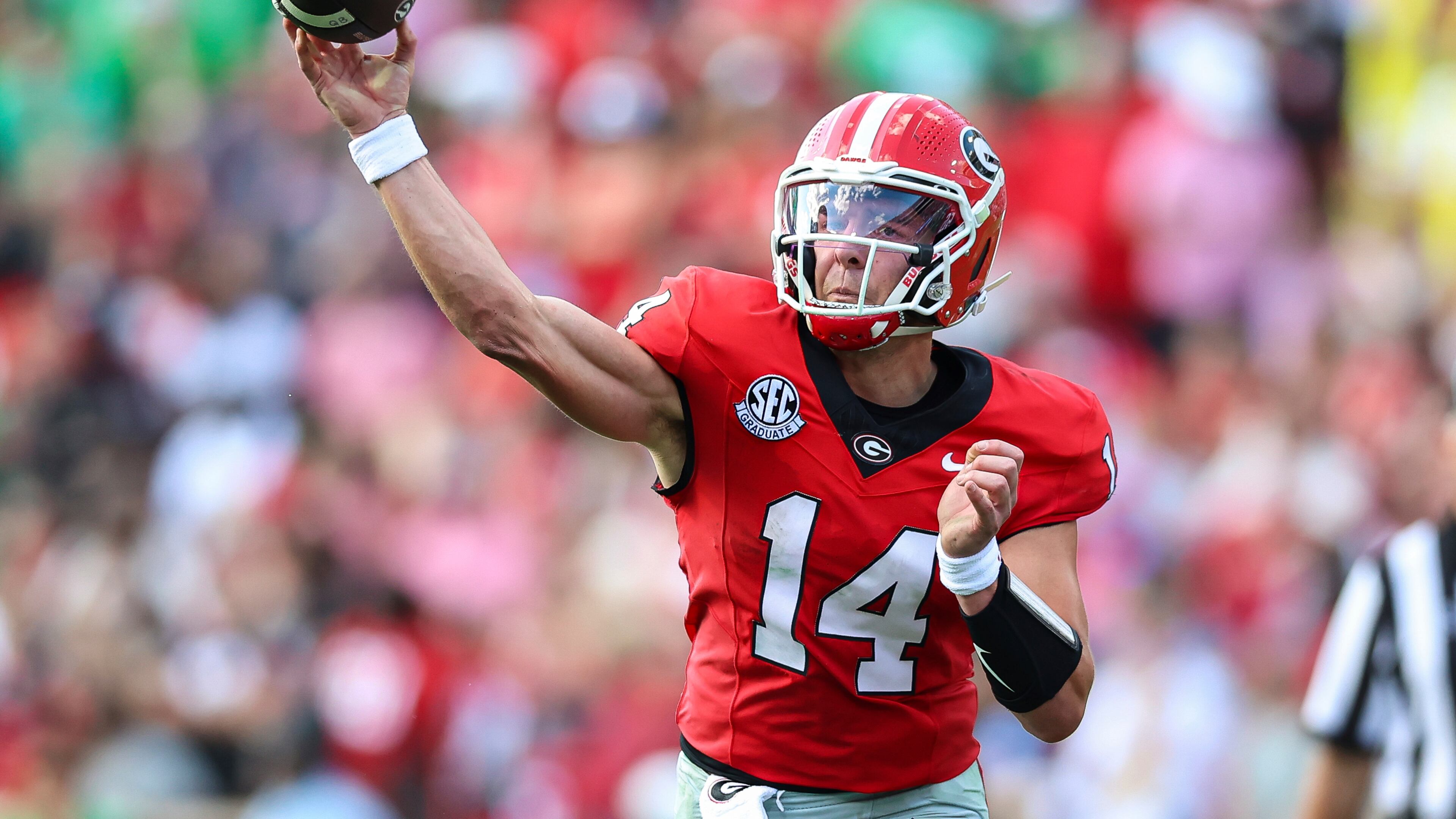 Georgia quarterback Gunner Stockton (14) throws a pass during the first half of an NCAA college football game against Marshall, Saturday, Aug. 30, 2025, in Athens, Ga. (AP Photo/Colin Hubbard)