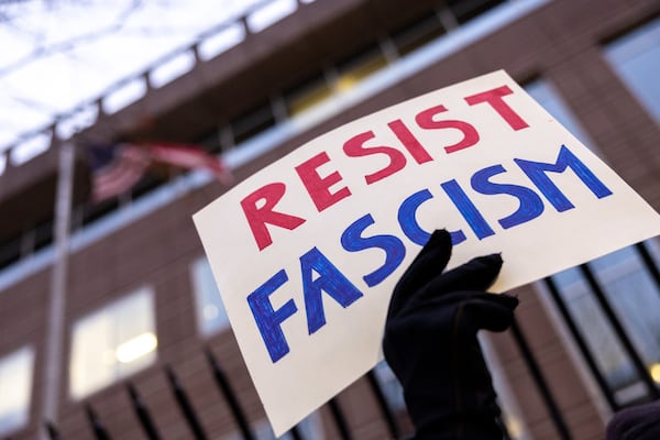 Demonstrators protest against Immigration and Customs Enforcement in front of the Atlanta ICE Field Office on Ted Turner Drive on Friday, Jan. 23, 2026. At least 200 people participated. (Arvin Temkar/AJC)
