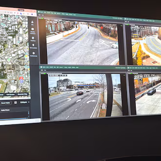 Monitors inside Chamblee's Real Time Crime Center show live camera feeds from parks and intersections across the city. (Shaddi Abusaid/AJC)