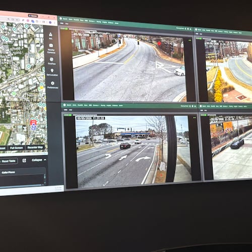 Monitors inside Chamblee's Real Time Crime Center show live camera feeds from parks and intersections across the city. (Shaddi Abusaid/AJC)
