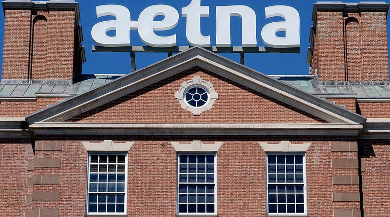 FILE - The corporate sign atop Aetna headquarters is seen Aug. 19, 2014, in Hartford, Conn. (AP Photo/Jessica Hill, File)