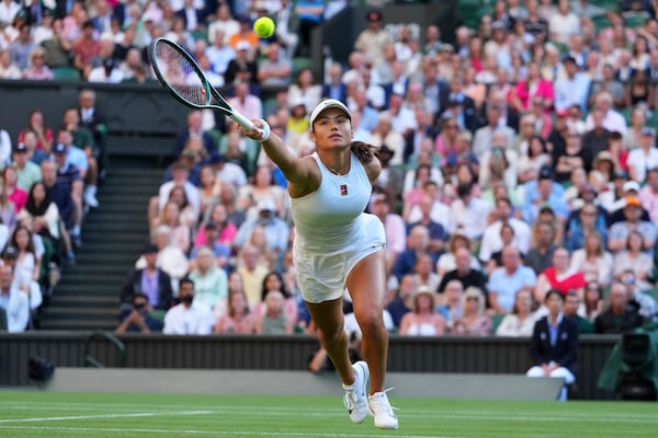 Emma Raducanu of Britain plays a return to Marketa Vondrousova of the Czech Republic during their second round women's singles match at the Wimbledon Tennis Championships in London, Wednesday, July 2, 2025.(AP Photo/Kirsty Wigglesworth)