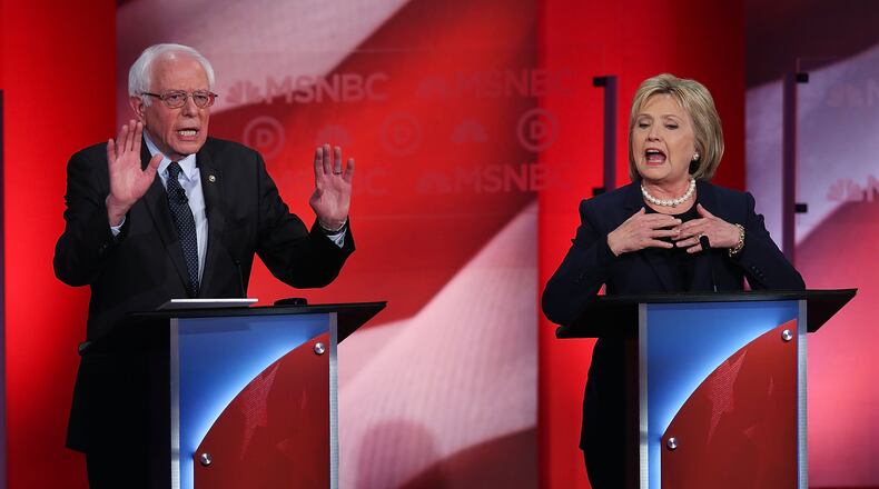 Democratic presidential candidates former Secretary of State Hillary Clinton and U.S. Sen. Bernie Sanders of Vermont during their MSNBC Democratic Candidates Debate at the University of New Hampshire on Monday. Justin Sullivan/Getty Images