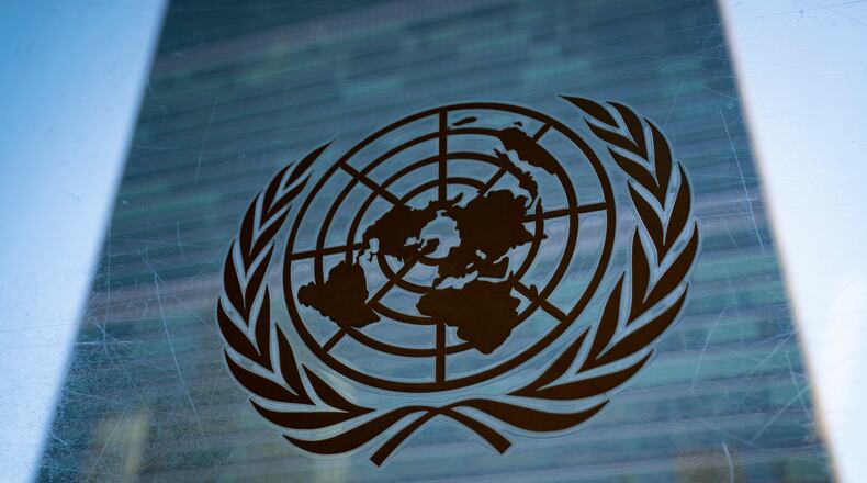 FILE - The symbol of the United Nations is displayed outside the Secretariat Building, Feb. 28, 2022, at United Nations Headquarters. (AP Photo/John Minchillo, File)