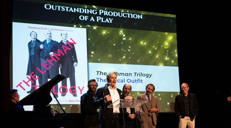 Theatrical Outfit, with actor Brian Kurlander speaking, accepts the Outstanding Play prize for "The Lehman Trilogy" at the 20th Suzi Bass Awards, Atlanta's version of the Tony Awards. (Courtesy of Robert Mitchel Owenby)