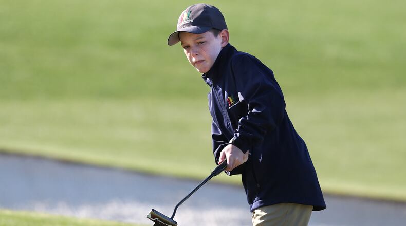 Brandt Prinsloo, Alpharetta, reacts to just missing his putt on the 18th green on his way to winning the putting competition category for Boys 7-9 during the Drive, Chip, and Putt Championship at Augusta National Golf Club on Sunday, April 4, 2021, in Augusta. “Curtis Compton / Curtis.Compton@ajc.com”