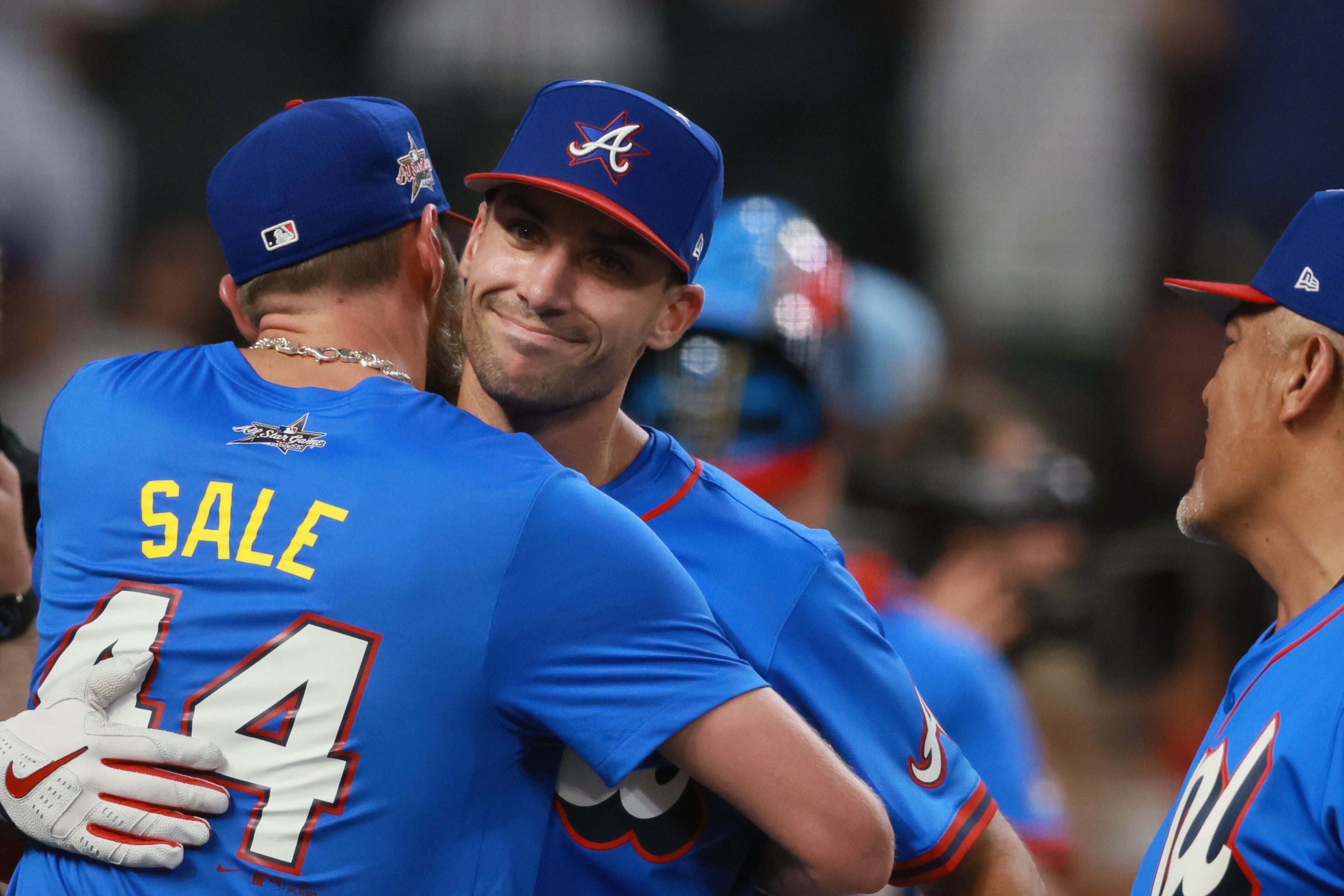 Atlanta Braves' first baseman Matt Olson is greeted by Braves pitcher Chris Sale and Braves coach Eddie Perez after batting during the MLB Home Run Derby as part of the All-Star Game festivities on Monday, July 14, 2025 at Truist Park in Atlanta. Jason Getz / AJC