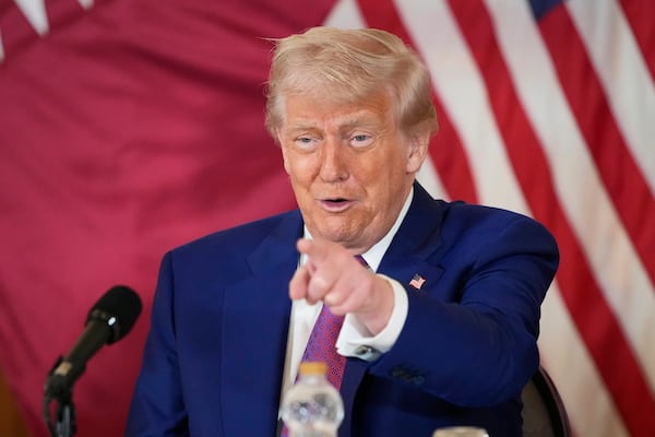 President Donald Trump gestures during a business roundtable, Thursday, May 15, 2025, in Doha, Qatar. (AP Photo/Alex Brandon)