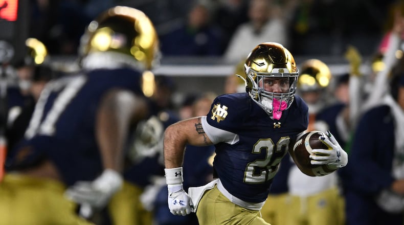 FILE - Notre Dame running back Aneyas Williams (22) rushes for a touchdown during the fourth quarter of an NCAA football game against Syracuse, Nov. 22, 2025, in South Bend, Ind. (AP Photo/Paul Beaty, File)