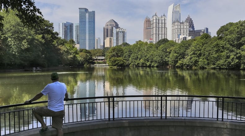 A man takes in the view at Piedmont Park in this AJC file photo.
