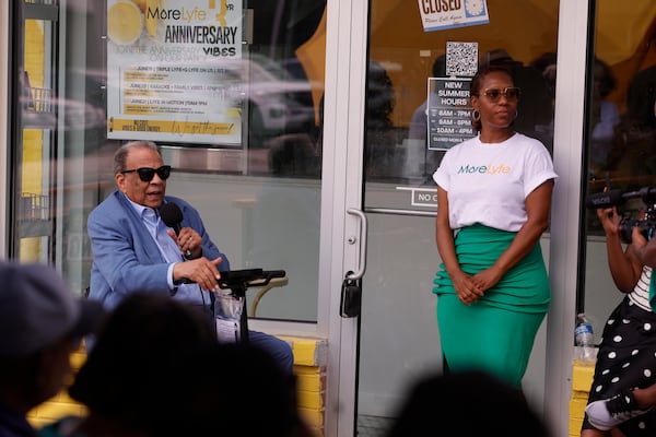 Ambassador Andrew Young (left) speaks to Cascade business owners and residents as More Lyfe Juice Co. owner Trinket Lewis looks on during a community meeting addressing damage from prolonged construction in the corridor on Tuesday, July 29, 2025. (Natrice Miller/AJC)