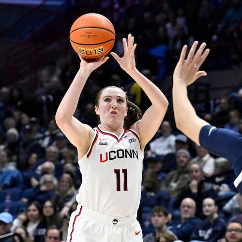UConn guard Allie Ziebell (11) shoots as Xavier guard Savannah White (2) defends in the first half of an NCAA college basketball game, Wednesday, Jan. 28, 2026, in Storrs, Conn. (AP Photo/Jessica Hill)