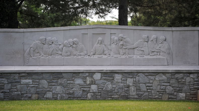 A carving of "The Last Supper" is one of the first details visitors to the Westview Cemetery see. The Atlanta Preservation Center does about ten different walking tours in and around town; Westview Cemetery is their brand new one. Paul Hammock, the education director, shows some details of the tour. KENT D. JOHNSON /KDJOHNSON@AJC.COM