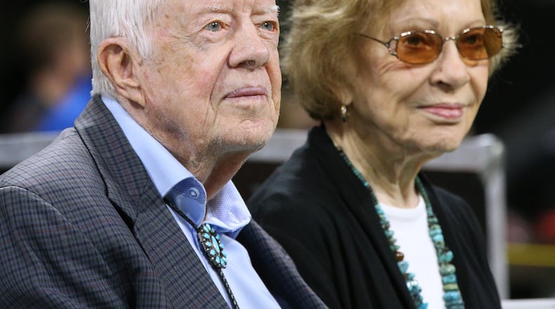 Former president Jimmy Carter and first lady Rosalynn Carter on the sidelines for a Falcons NFL football game on Sunday, Sept 30, 2018, in Atlanta.   Curtis Compton/ccompton@ajc.com