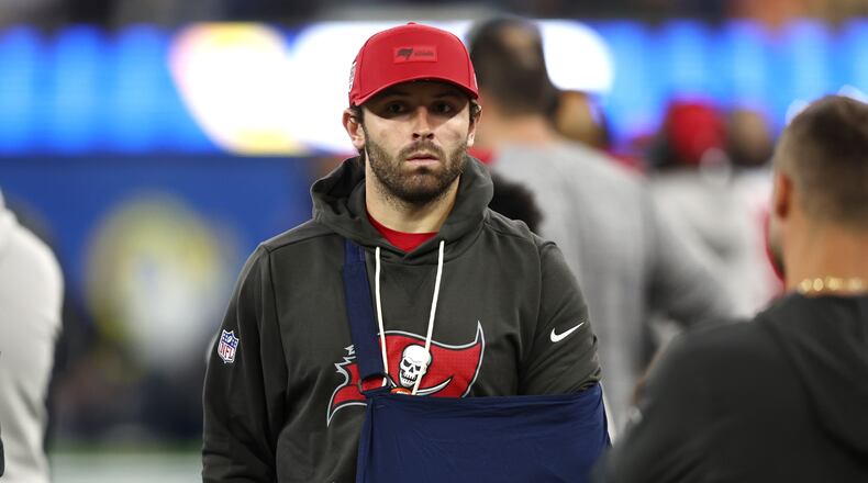 Tampa Bay Buccaneers quarterback Baker Mayfield (6) looks on from the sidelines wearing a sling during the second half against the Los Angeles Rams in an NFL football game Sunday, Nov. 23, 2025, in Inglewood, Calif. (AP Photo/Jessie Alcheh)
