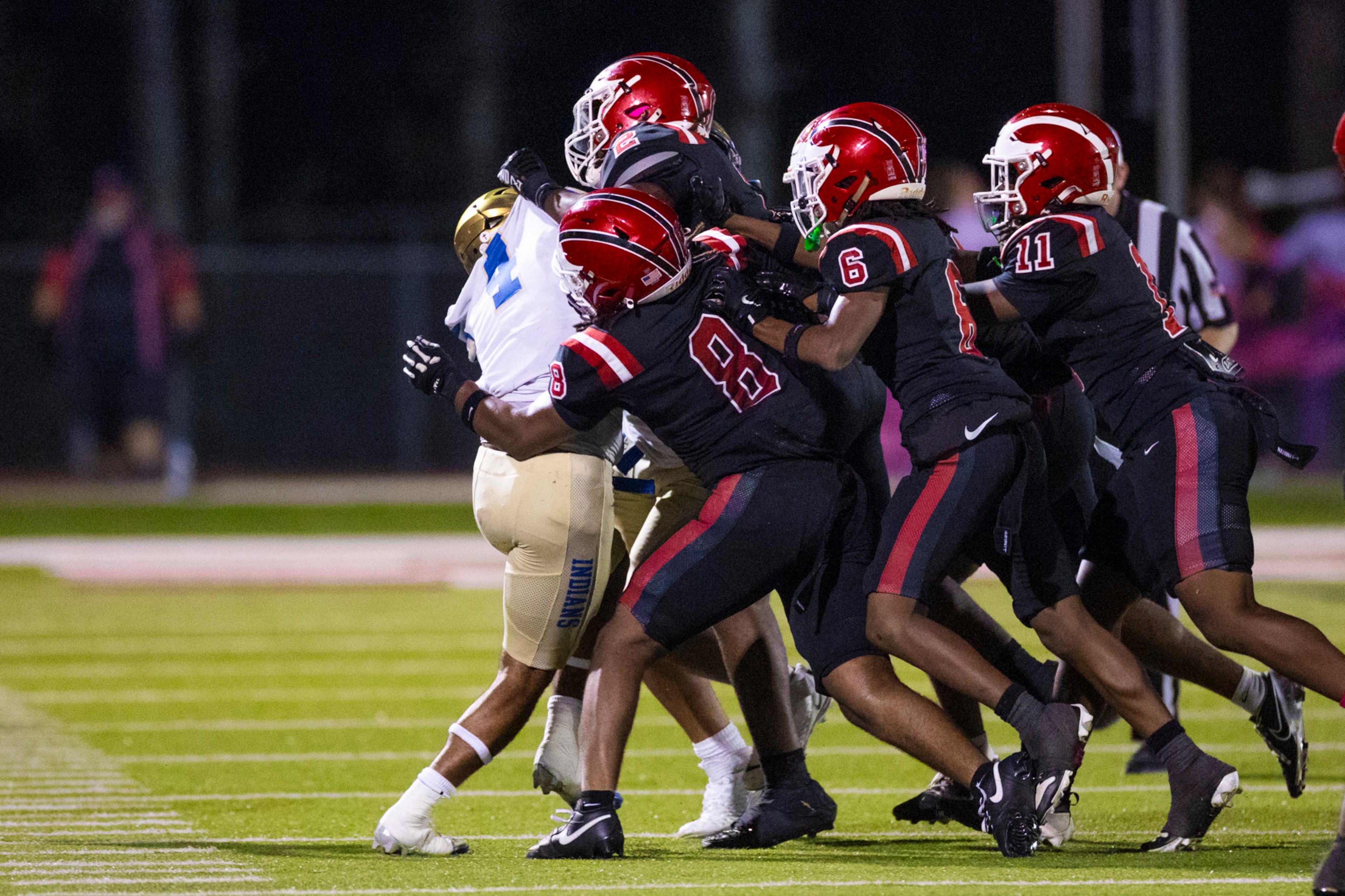McEachern wide receiver Zavion Harris (1) is tackled against Hillgrove at Cobb Energy Hillgrove Stadium in Powder Springs, GA on Friday, October 17th, 2025. (Oscar Guevara Saenz for the AJC)