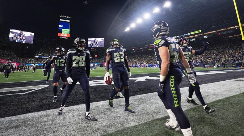 Seattle Seahawks' Dareke Young (83) celebrates after recovering a fumble by Los Angeles Rams wide receiver Xavier Smith during a punt return during the second half of the NFC Championship NFL football game Sunday, Jan. 25, 2026, in Seattle. (AP Photo/Lindsey Wasson)