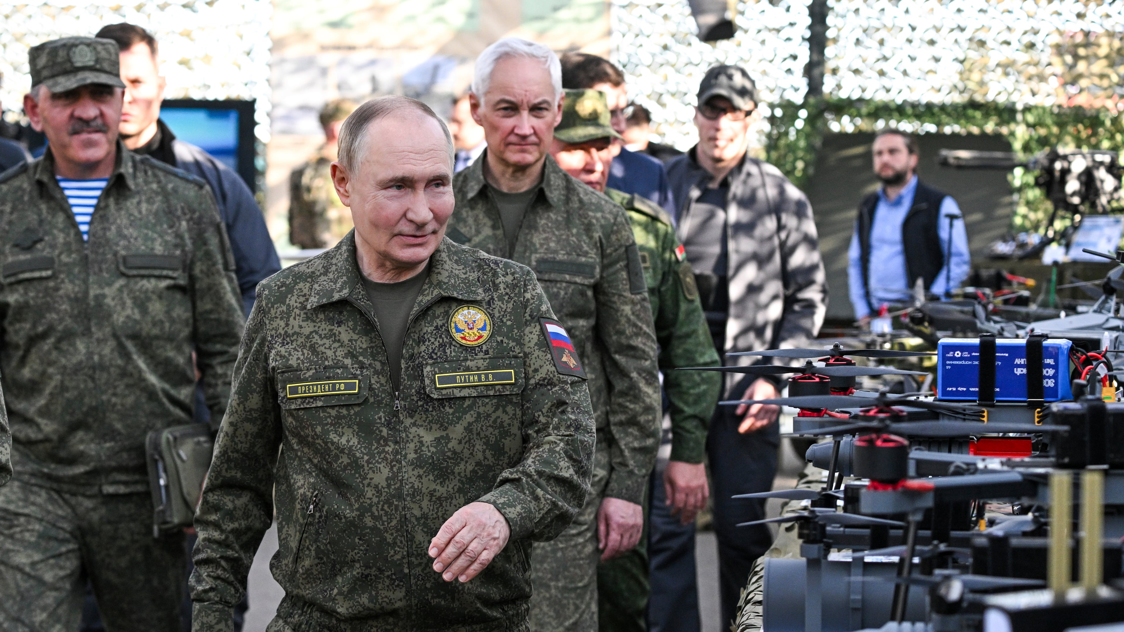 CORRECTS SOURCE FOR POOL - Russian President Vladimir Putin accompanied by Deputy Defence Minister Yunus-Bek Yevkurov, left, and Defence Minister Andrei Belousov, right, inspects Russian weapons and equipment during his visit to the Russian-Belarusian joint military drills "Zapad 2025" (West 2025) at the Mulino training ground in Nizhny Novgorod region, Russia, Tuesday, Sept. 16, 2025. (Sergey Bobylev/Sputnik, Kremlin Pool Photo via AP)