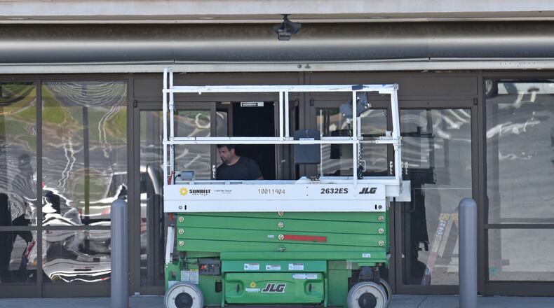 May 2, 2019 Decatur - A crew works on obvious movie set at an empty mall at North DeKalb Mall in Decatur on Thursday, May 2, 2019. North DeKalb is getting a new life as a site for film productions, turning vacant storefronts into fictional sets. HYOSUB SHIN / HSHIN@AJC.COM