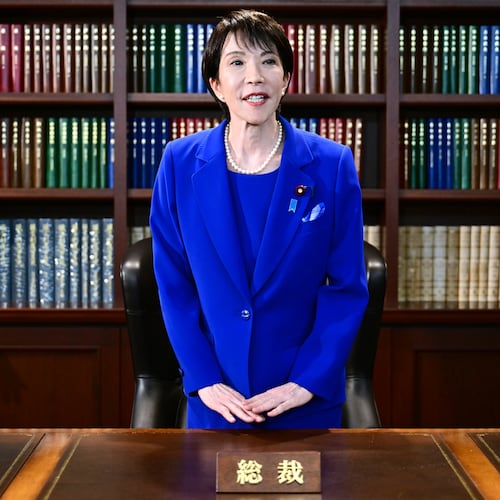 FILE - Sanae Takaichi, the newly-elected leader of Japan's ruling party, the Liberal Democratic Party (LDP), gestures as she leaves the party leader's office after the LDP leadership election in Tokyo, on Oct. 4, 2025. (Yuichi Yamazaki/Pool Photo via AP, File)