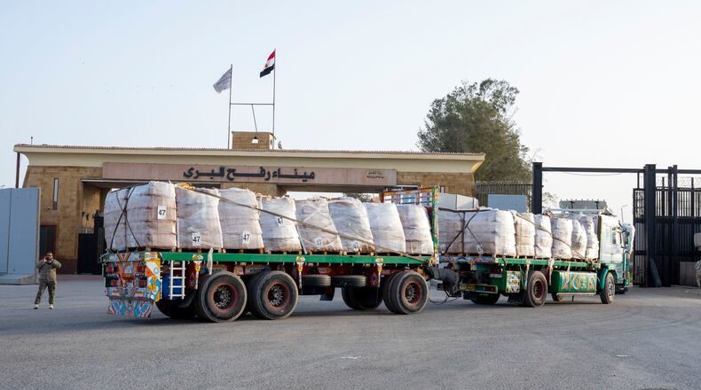 A truck enters the Egyptian gate of the Rafah crossing, heading for inspection by Israeli authorities before entering the Gaza Strip, Tuesday, Jan. 27, 2026. (AP Photo/Mohamed Arafat)