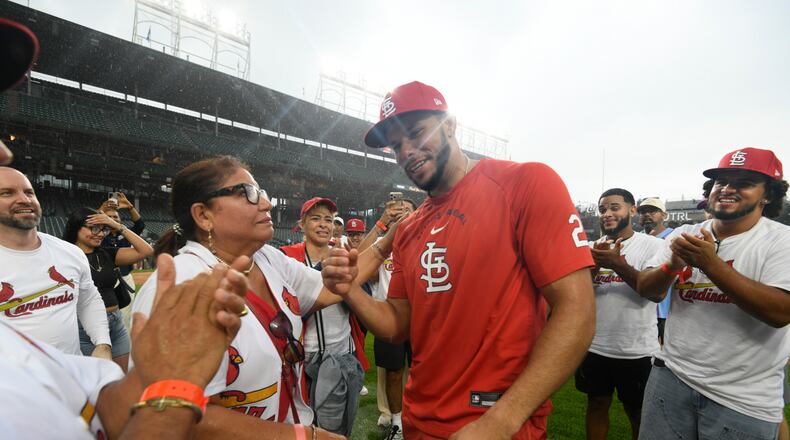 St. Louis Cardinals' Joshua Baez, right, celebrates with his mother Yris Carmen Baez, left, after defeating the Chicago Cubs in a baseball game in Chicago, Saturday, Aug. 15, 2026. (AP Photo/Paul Beaty)