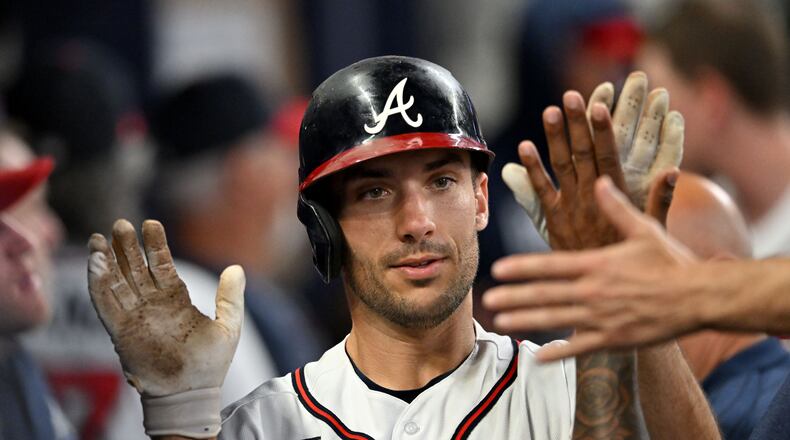 Atlanta Braves' first baseman Matt Olson (28) celebrates with teammates after hitting a solo home run during the fifth inning at Truist Park. (Hyosub Shin / Hyosub.Shin@ajc.com)