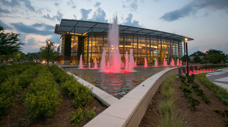 June 9, 2018- Sandy Springs, Ga: The fountain is lit up with red lights in front of the Sandy Springs Performing Arts Center at sun set in Sandy Springs Saturday, June 9, 2018, in Sandy Springs, Ga. This is for a story about the Sandy Springs City Center to be published in the August issue of Living Northside. PHOTO / JASON GETZ