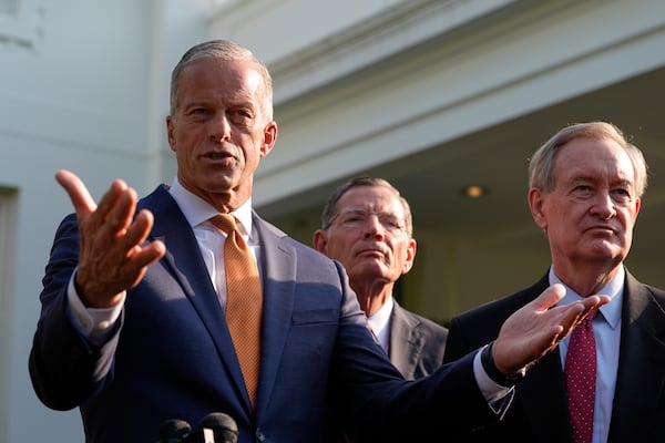 FILE - Senate Majority Leader John Thune, R-S.D., flanked by Sen. John Barrasso, R-Wyo., center, and Sen. Mike Crapo, R-Idaho, speak with reporters after meeting with President Donald Trump at the White House, June 4, 2025, in Washington. (AP Photo/Alex Brandon, file)