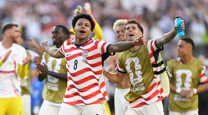 United States' Weston McKennie (8) and Christian Pulisic (10) celebrate winning the World Cup round of 32 soccer match between the United States and Bosnia in Santa Clara, Calif., near San Francisco, Wednesday, July 1, 2026. (AP Photo/Eakin Howard)