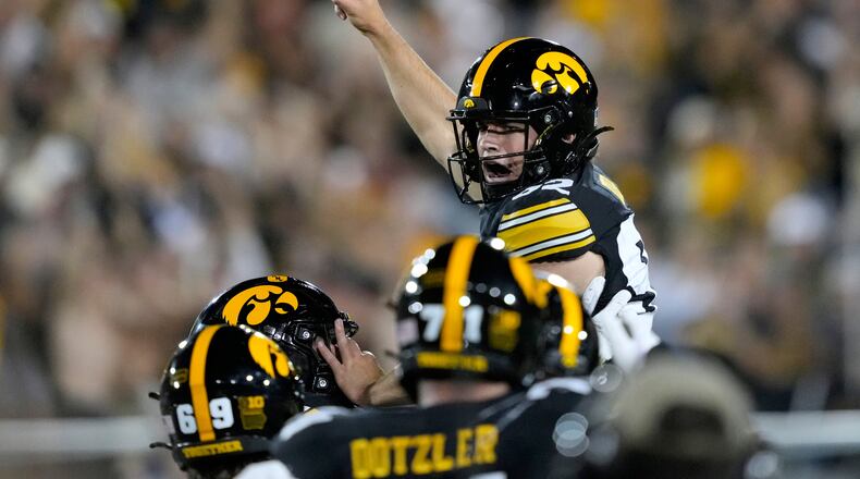 Iowa place kicker Caden Buhr celebrates with teammates after kicking a field goal during the second half of an NCAA college football game against Iowa State, Saturday, Sept. 12, 2026, in Iowa City, Iowa. (AP Photo/Charlie Neibergall)