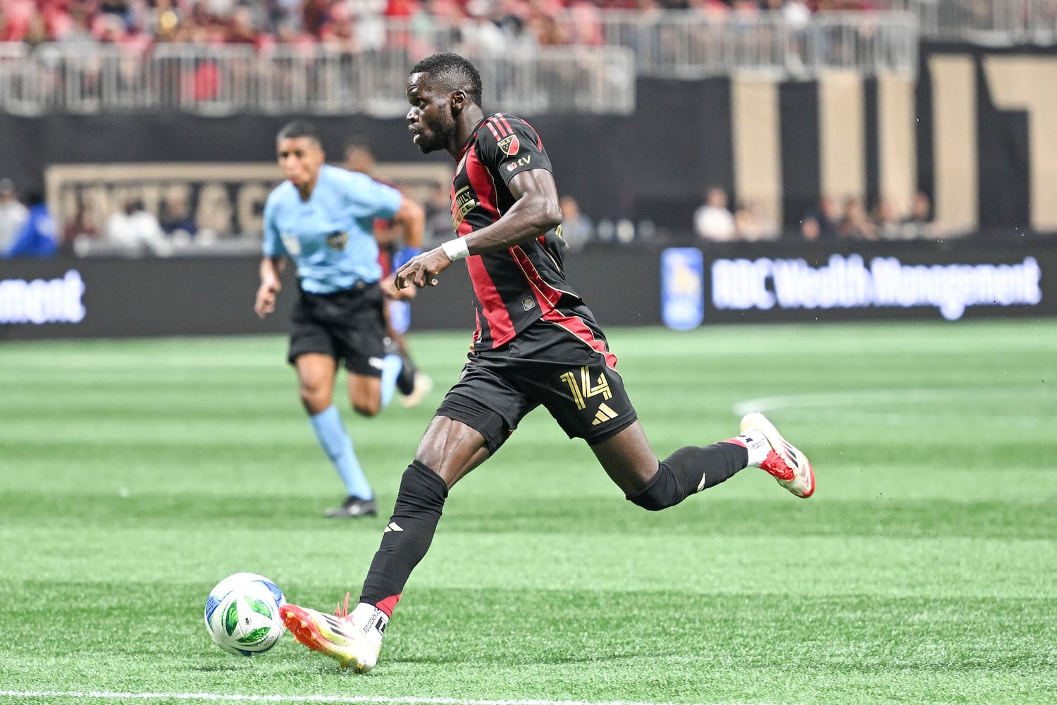 Atlanta United forward Jamal Thiaré (14) drives the ball towards FC Cincinnati’s goal during the second half of a MLS soccer game Sunday, May 25, 2025 at the Mercedes-Benz Stadium. (Daniel Varnado/For the Atlanta Journal-Constitution)