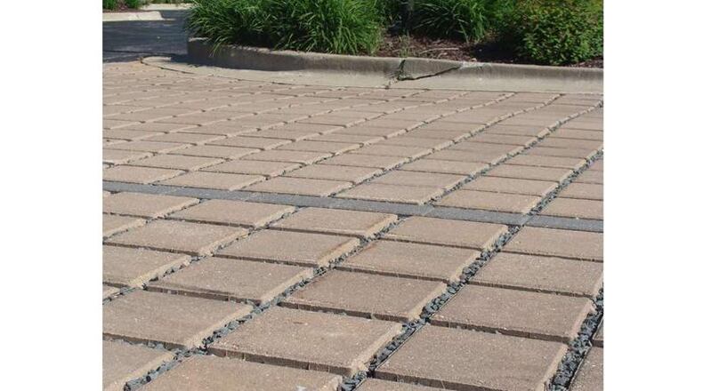Permeable pavers like these could improve the quality of stormwater discharging from Roswell City Hall to a tributary of Hog Waller Creek. The city is seeking a $150,000 grant to fund the project. AJC FILE