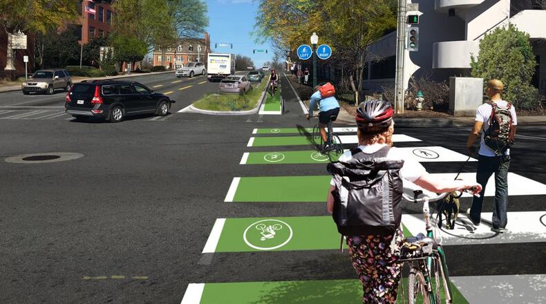 Photo overlaid with an artist’s rendition of what Commerce Drive could look like with lane reductions, bike track and widened sidewalks. The city is also working on a more efficient signal-timing plan to move automobiles and pedestrians more efficiently along Howard and other downtown streets. Courtesy City of Decatur