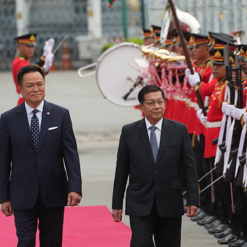 Thailand's Prime Minister Anutin Charnvirakul, left, and Myanmar's President Min Aung Hlaing review an honor guard during a welcome ceremony at the Government House in Bangkok, Thailand Thursday, Aug. 6, 2026. (AP Photo/Sakchai Lalit)