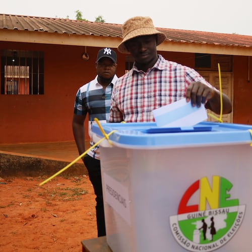 A man casts his vote during the Presidential and legislative elections, in Bissau, Guinea-Bissau, Sunday, Nov. 23, 2025. (AP Photo/Darcicio Barbosa)