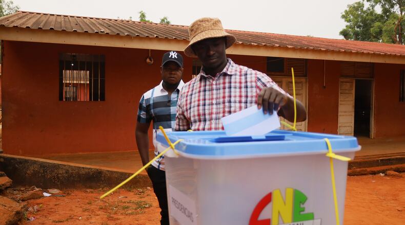 A man casts his vote during the Presidential and legislative elections, in Bissau, Guinea-Bissau, Sunday, Nov. 23, 2025. (AP Photo/Darcicio Barbosa)
