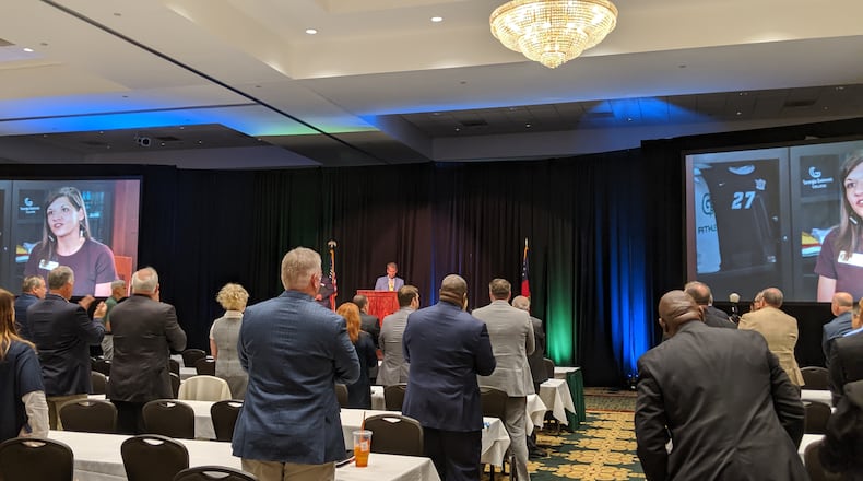 School superintendents from across Georgia applaud as Gov. Brian Kemp prepares to speak at their annual conference in Athens on Thursday, Oct. 17, 2019. Kemp reiterated a campaign pledge to raise teacher pay by $5,000. He and lawmakers gave them $3,000 this year, and Kemp said he would follow through with the rest without committing to a timeline. TY TAGAMI / AJC