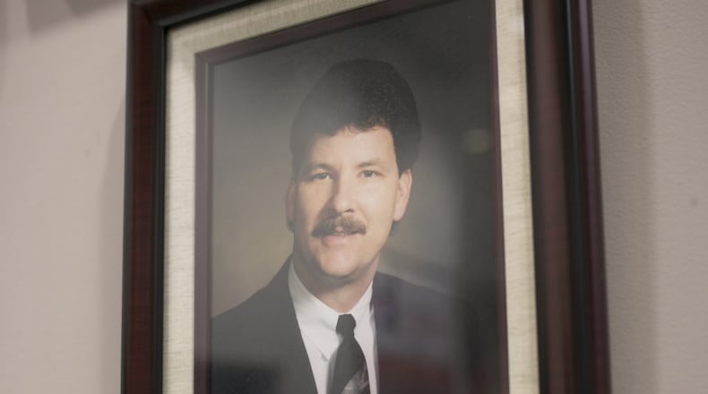 A portrait of board member Daniel D. Seckinger was added to the wall of past board members on Thursday, Dec. 20, 2018. At the same board meeting it was announced that the newest high school on the project list — on in the Mill Creek cluster will be named for Seckinger. (Casey Sykes for The Atlanta Journal-Constitution)