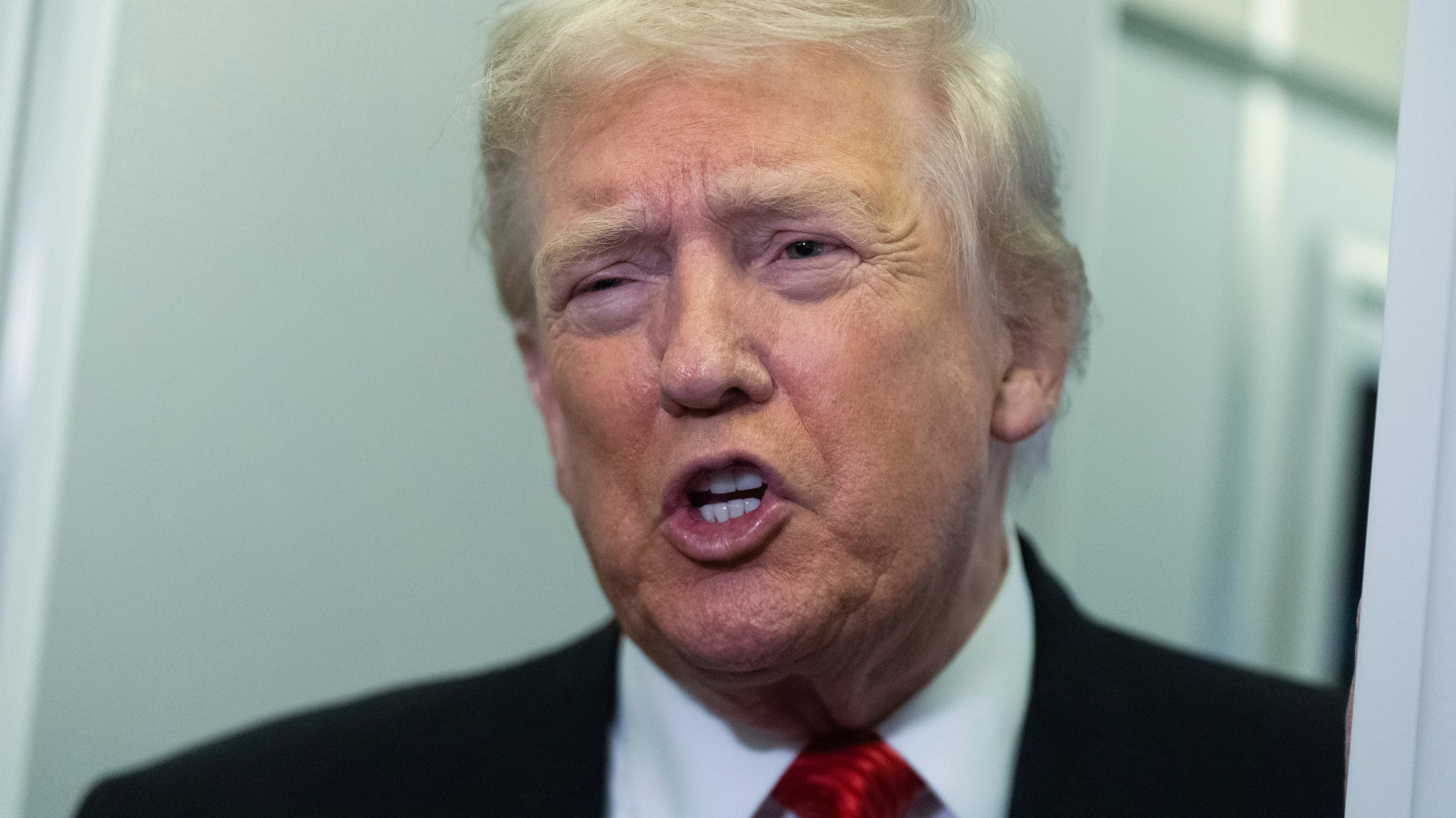 President Donald Trump speaks to reporters on board Air Force One on his way back to the White House from a weekend trip at his Mar-a-Lago estate in Palm Beach, Fla., Sunday, Nov. 2, 2025. (AP Photo/Manuel Balce Ceneta)
