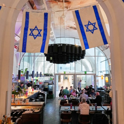 Israeli flags hang in the designated Israel "Euro Cafe" MQ Kantine during the 70th Eurovision Song Contest week in Vienna, Austria, Wednesday, May 13, 2026. (AP Photo/Martin Meissner)