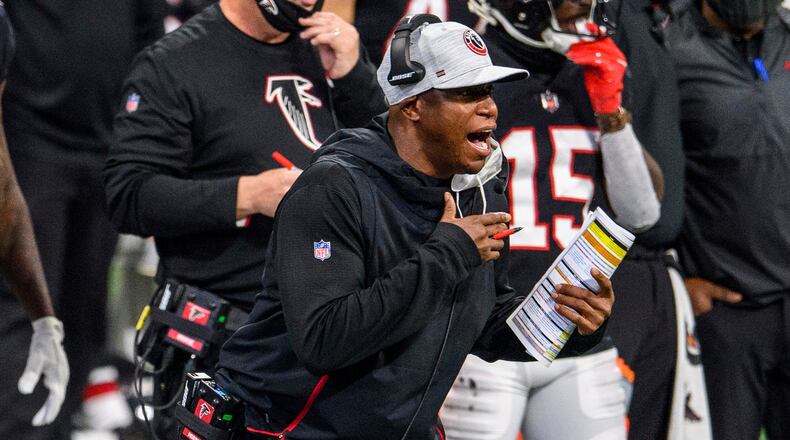 Falcons interim coach Raheem Morris works during the first half  against the Saints, Sunday, Dec. 6, 2020, at Mercedes-Benz Stadium in Atlanta. The Saints won 21-16. (Danny Karnik/AP)