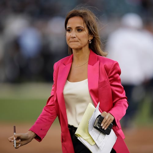 FILE- Reporter Dianna Russini works on the sidelines before the start of an NFL football game between the Oakland Raiders and the Denver Broncos Monday, Sept. 9, 2019, in Oakland, Calif. (AP Photo/Ben Margot, File)