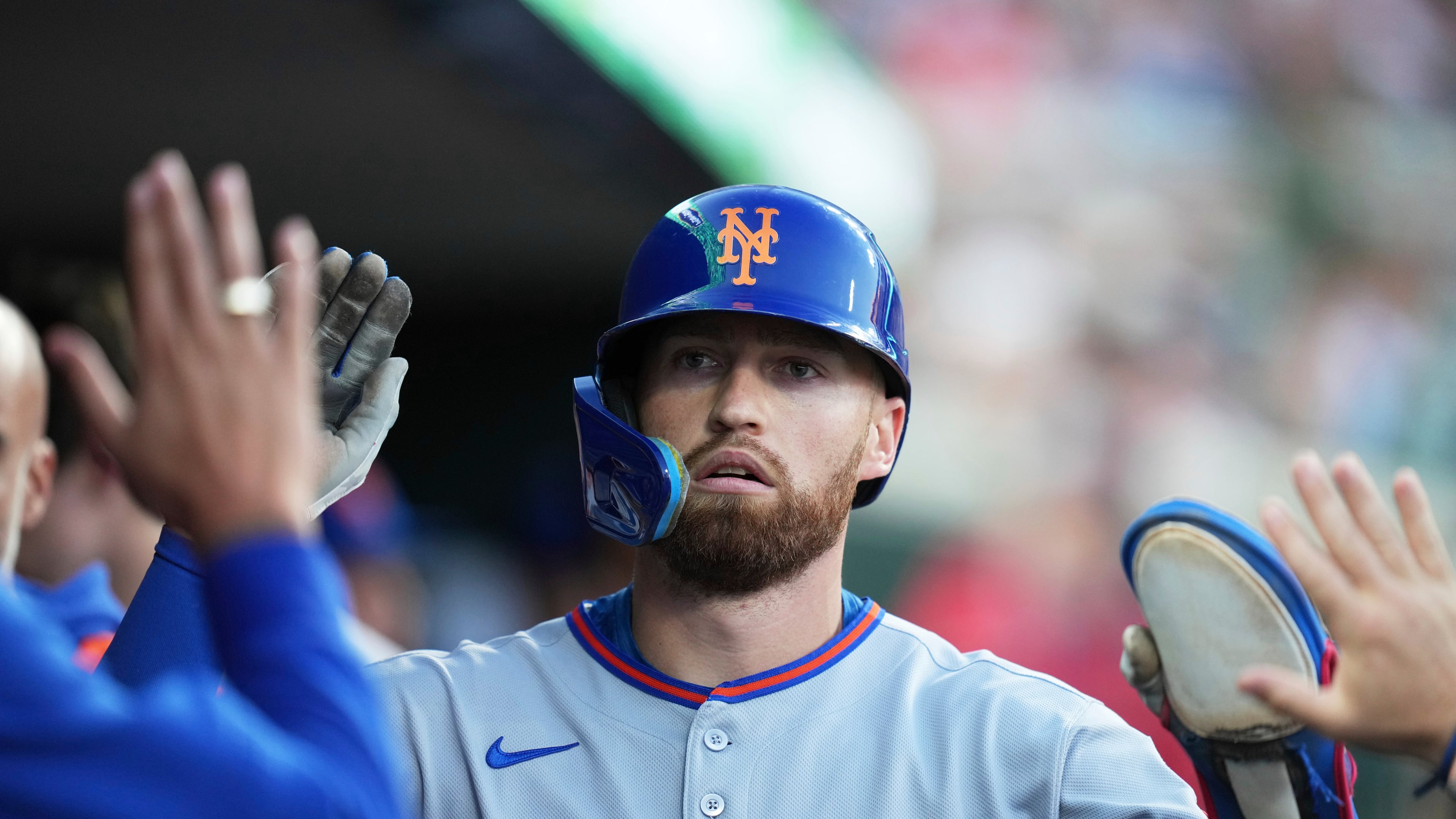 FILE - New York Mets' Brandon Nimmo celebrates in the dugout after scoring off of a sacrifice fly by Cedric Mullins during the fourth inning of a baseball game against the Detroit Tigers, Tuesday, Sept. 2, 2025, in Detroit. (AP Photo/Ryan Sun, File)