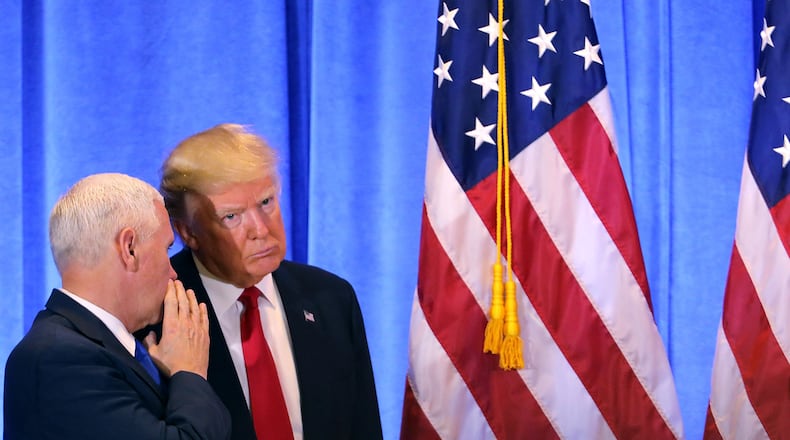 NEW YORK, NY - JANUARY 11: President-elect Donald Trump stands with Vice President-elect Mike Pence at a news conference at Trump Tower on January 11, 2017 in New York City. This is Trump's first official news conference since the November elections. (Photo by Spencer Platt/Getty Images)