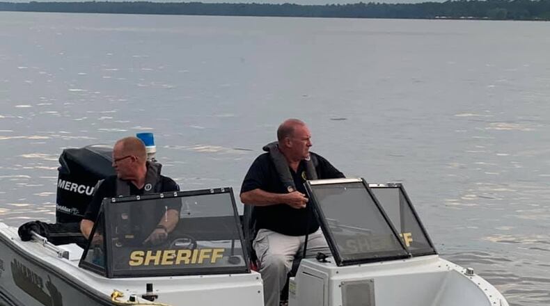 Deputies with the Crisp County Sheriff's Office search Lake Blackshear for Abraham Levy, 25, of Atlanta, whose body was found two days after he disappeared.