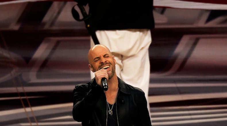 ARLINGTON, TX - APRIL 05: Chris Daughtry performs the national anthem prior to the NCAA Men's Final Four Semifinal between the Connecticut Huskies and the Florida Gators at AT&T Stadium on April 5, 2014 in Arlington, Texas. (Photo by Jamie Squire/Getty Images) ARLINGTON, TX - APRIL 05: Chris Daughtry performs the national anthem prior to the NCAA Men's Final Four Semifinal between the Connecticut Huskies and the Florida Gators at AT&T Stadium on April 5, 2014 in Arlington, Texas. (Photo by Jamie Squire/Getty Images)